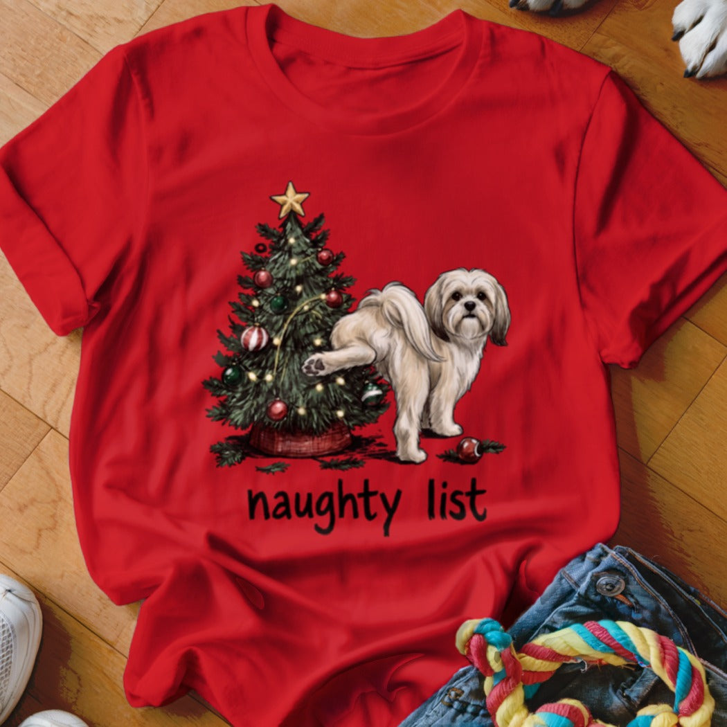 Shih Tzu dog next to a Christmas tree with the text "naughty list."