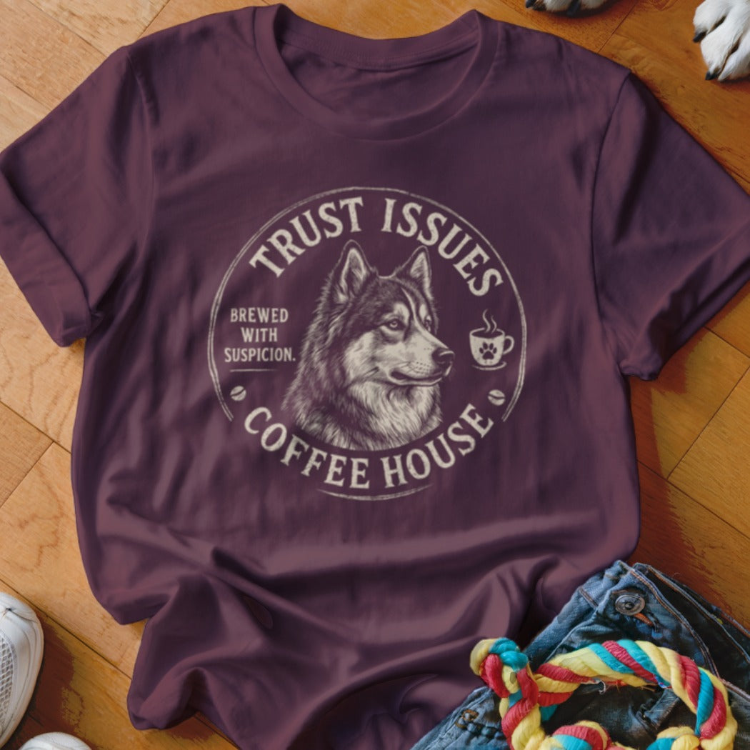 Maroon t-shirt with a circular graphic featuring a wolf and text "Trust Issues Coffee House".