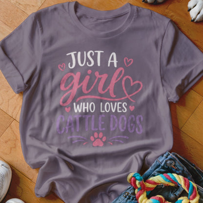T-shirt with "Just a girl who loves cattle dogs" text and paw print.