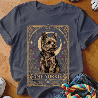 A dark gray t-shirt featuring a tarot card graphic of a Yorkshire terrier with the text "THE YORKIE".