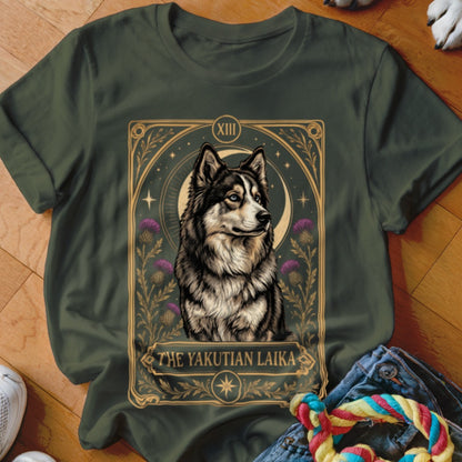 Dark green t-shirt featuring a tarot-style graphic of a Yakutian Laika surrounded by thistles and stars.