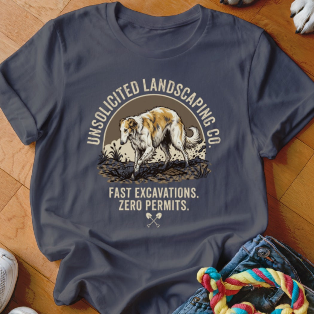 Dark grey t-shirt with graphic of a dog and text "Unsolicited Landscaping Co. Fast Excavations. Zero Permits."