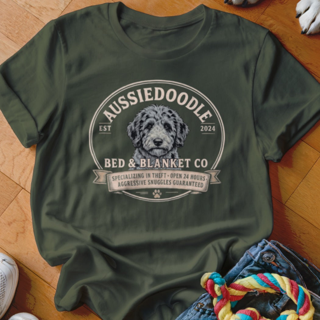 Green t-shirt with Aussiedoodle Bed & Blanket Co. logo featuring a dog.