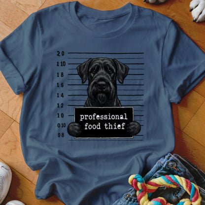 Black Schnauzer with a "professional food thief" sign in a mugshot lineup.
