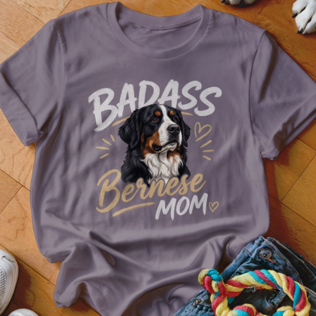 A mauve t-shirt with a graphic of a Bernese Mountain Dog and the text Badass Bernese Mom.
