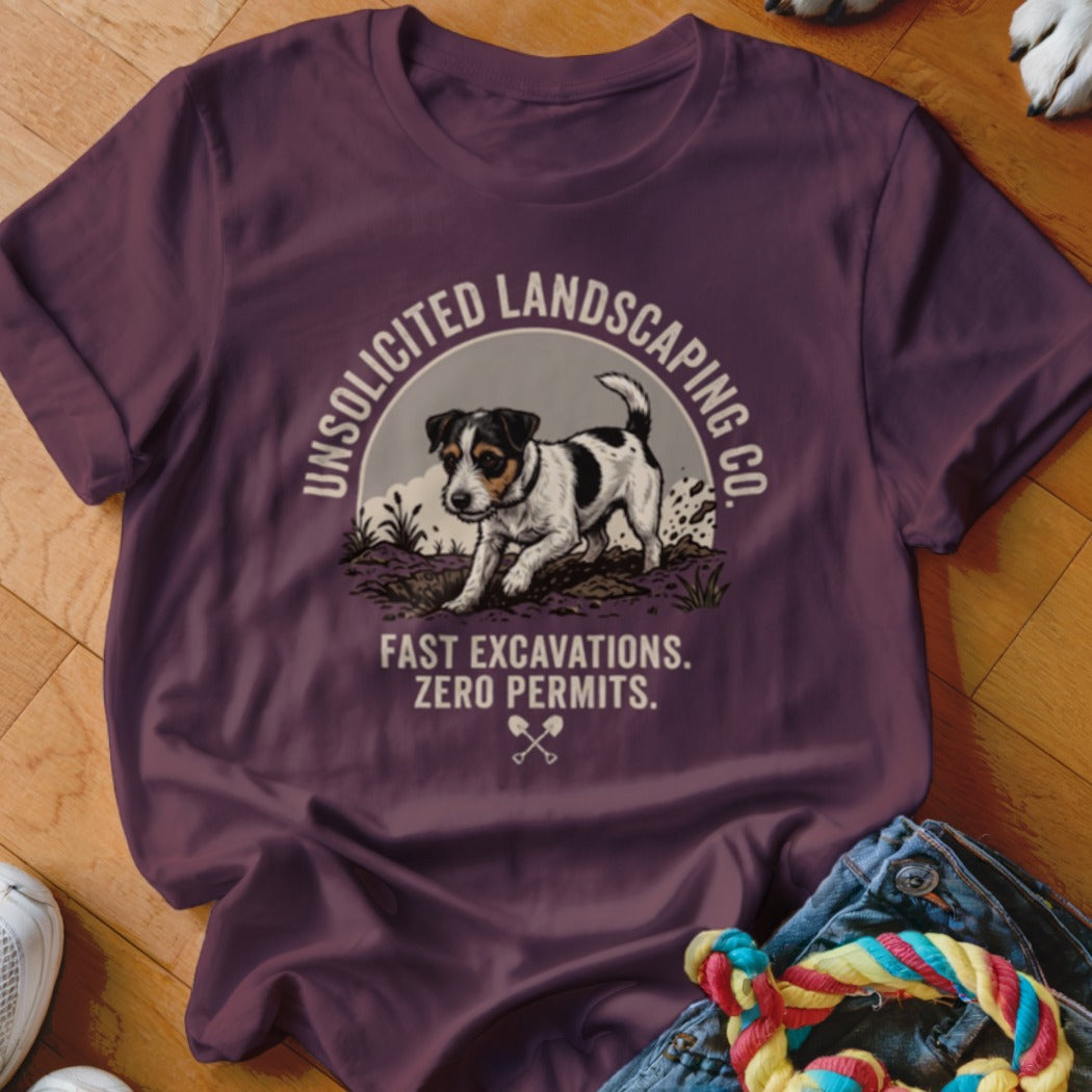 T-shirt with graphic of a dog digging, text "UNSOLICITED LANDSCAPING CO. FAST EXCAVATIONS. ZERO PERMITS."