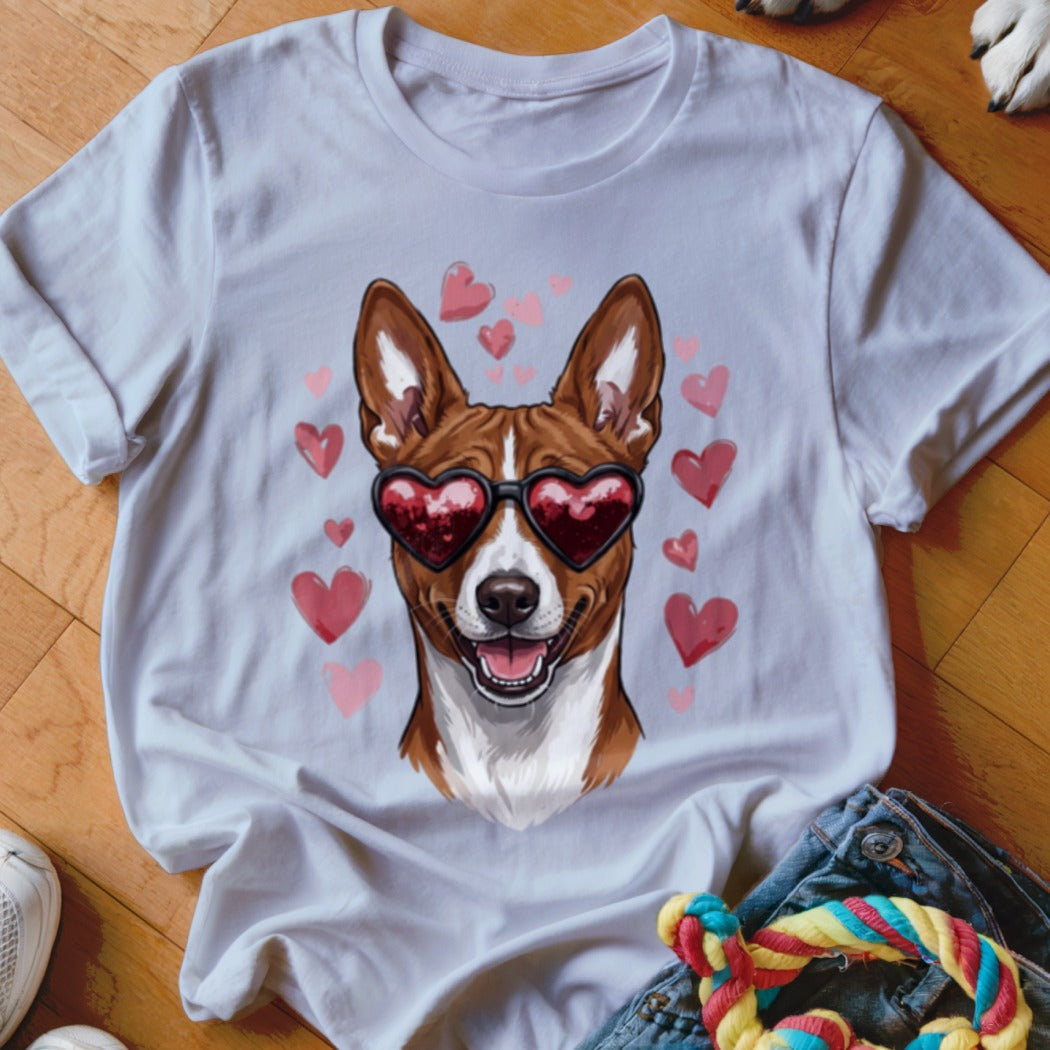 White t-shirt featuring a graphic of a brown and white dog wearing heart-shaped sunglasses, surrounded by pink hearts.