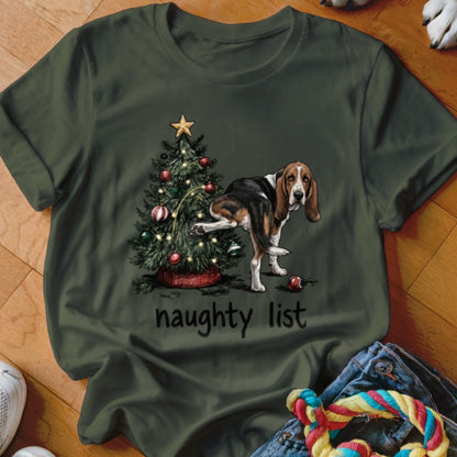 Basset Hound near Christmas tree with text "naughty list"