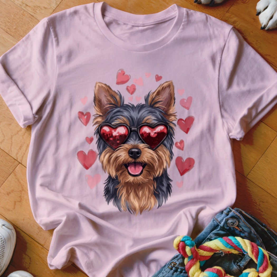 Light pink crewneck t-shirt featuring an illustration of a Yorkshire Terrier wearing heart-shaped sunglasses surrounded by pink hearts.