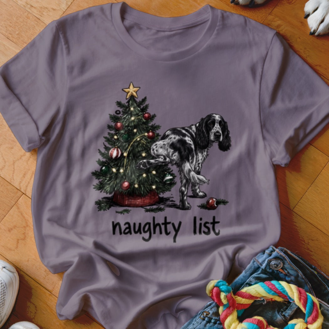 English Setter peeing on Christmas tree with "naughty list" text.