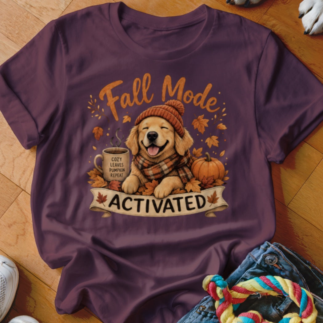 Golden retriever wearing scarf and hat with "Fall Mode Activated" text.