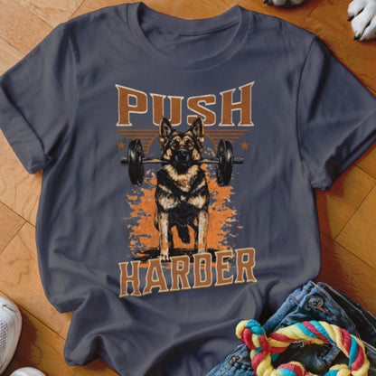 German Shepherd lifting barbell with text "Push Harder" on t-shirt.