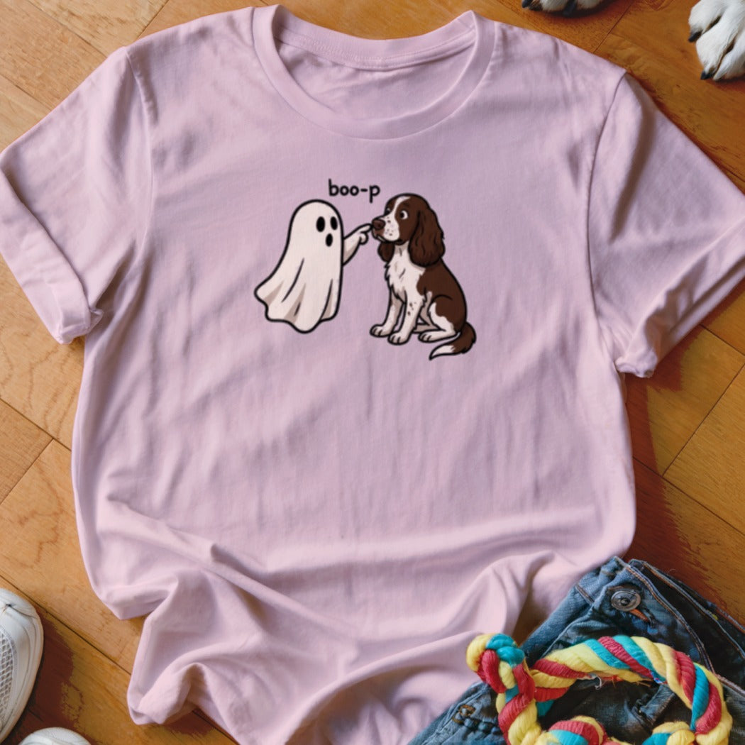 Pink t-shirt with cartoon ghost saying "boo-p" and poking a brown and white dog.