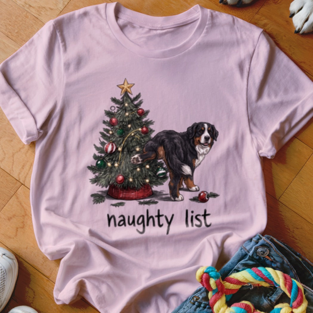 Bernese Mountain Dog by Christmas tree with "naughty list" text.