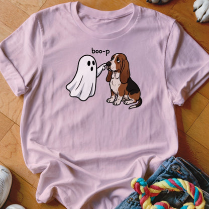 Pink t-shirt with a cartoon ghost "booping" a Basset Hound dog.