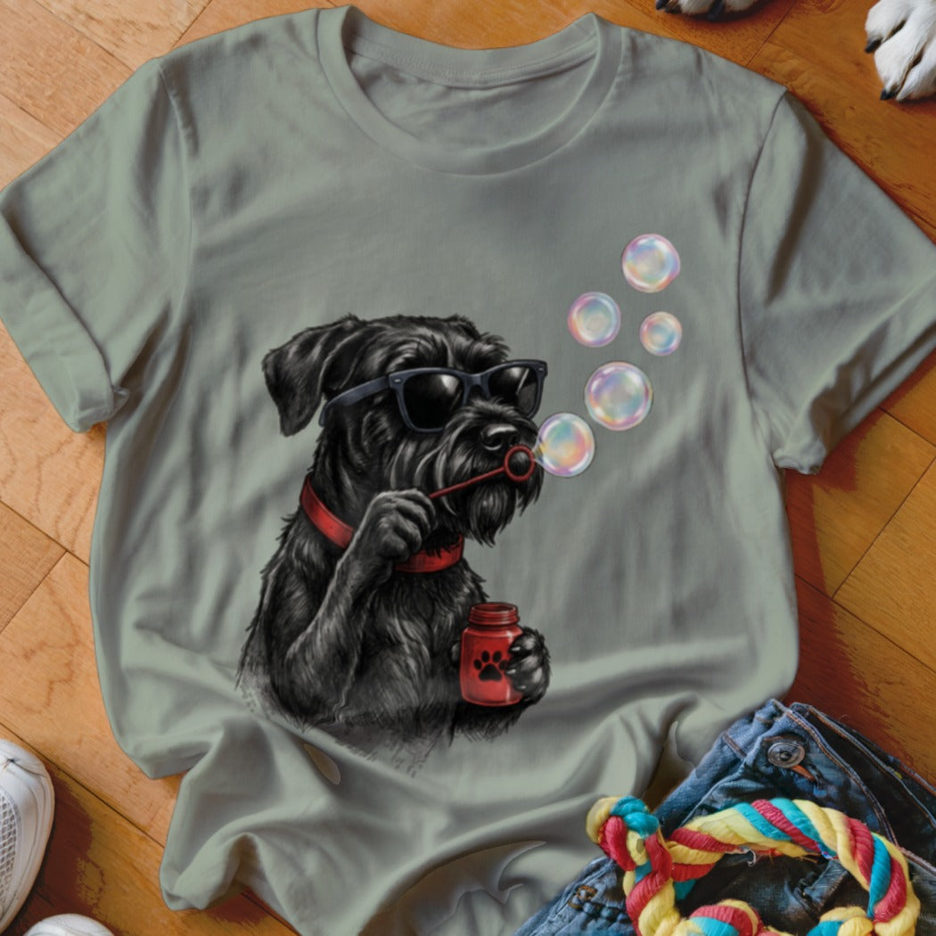Sage green crewneck t-shirt featuring a graphic of a black dog wearing sunglasses and blowing bubbles.