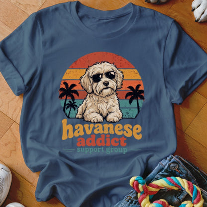 A dark blue t-shirt with a retro graphic of a fluffy Havanese dog wearing sunglasses.