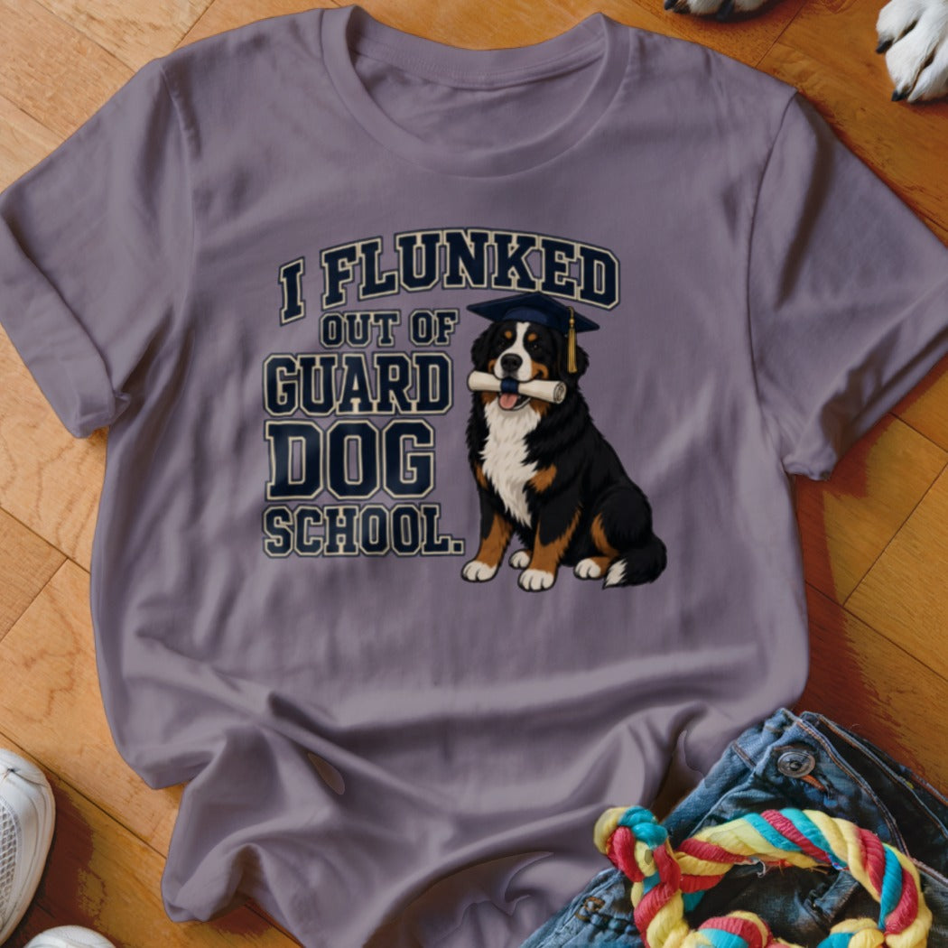 Bernese Mountain Dog in graduation cap holding diploma with text "I flunked out of guard dog school."