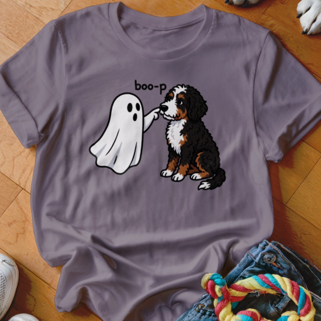 Bernese Mountain Dog puppy being poked by a ghost with the text "boo-p".