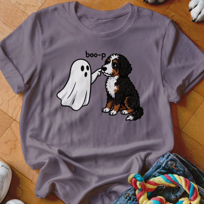 Bernese Mountain Dog puppy being poked by a ghost with the text "boo-p".