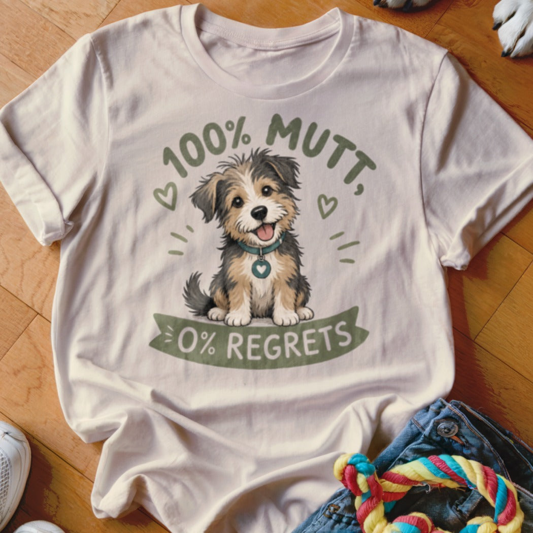 White t-shirt with illustration of a happy dog, "100% Mutt, 0% Regrets" text.