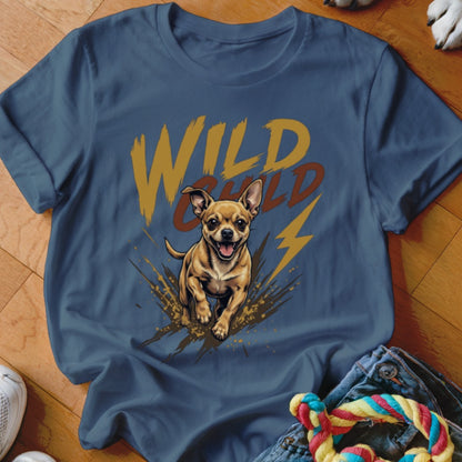 A blue t-shirt featuring a graphic of a running chihuahua, mud splatters, and the text WILD CHILD.