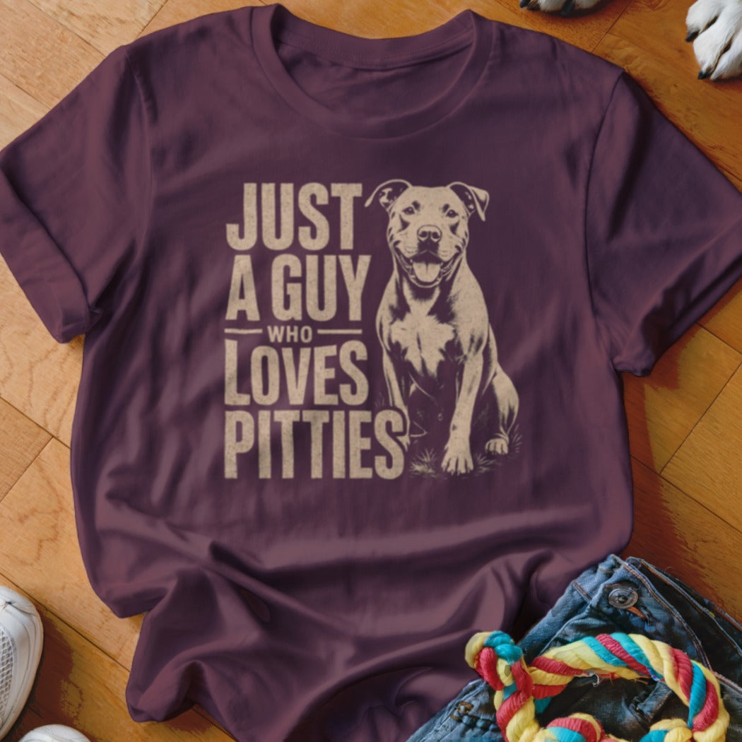 T-shirt with text "JUST A GUY WHO LOVES PITTIES" and a pit bull illustration.