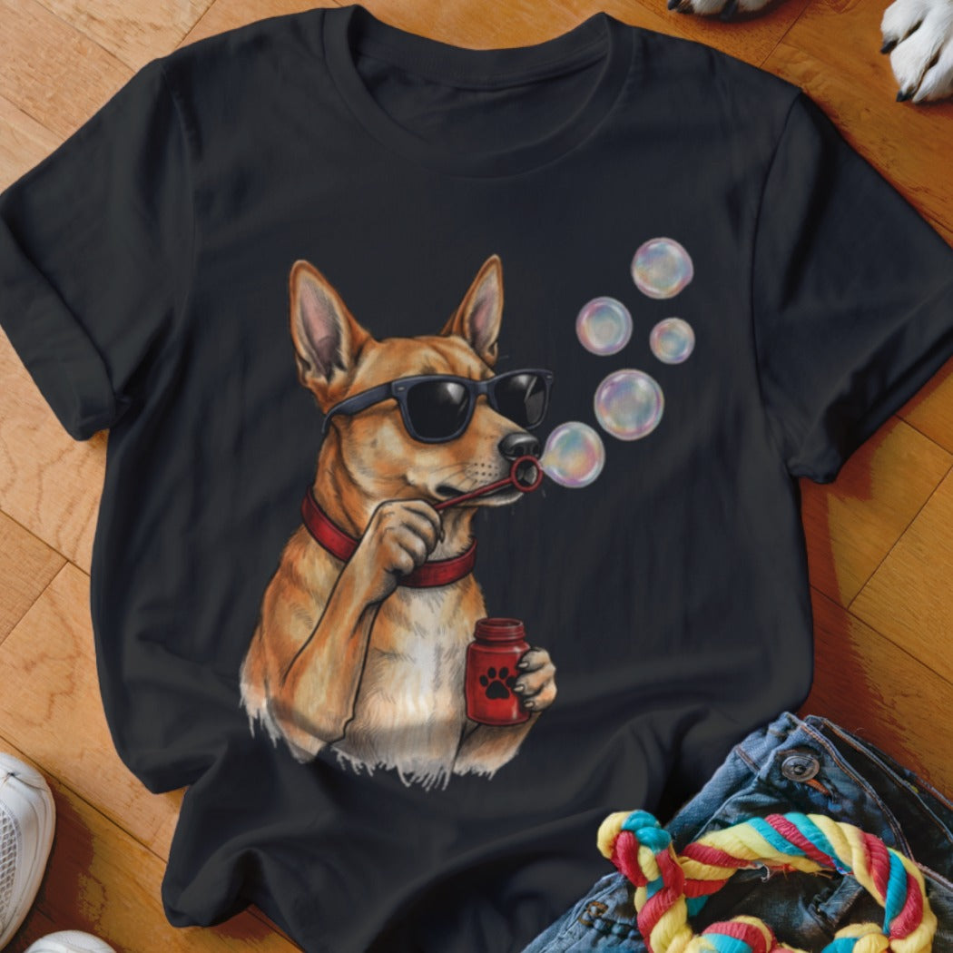 Black t-shirt featuring an illustration of a brown dog wearing sunglasses and blowing soap bubbles.