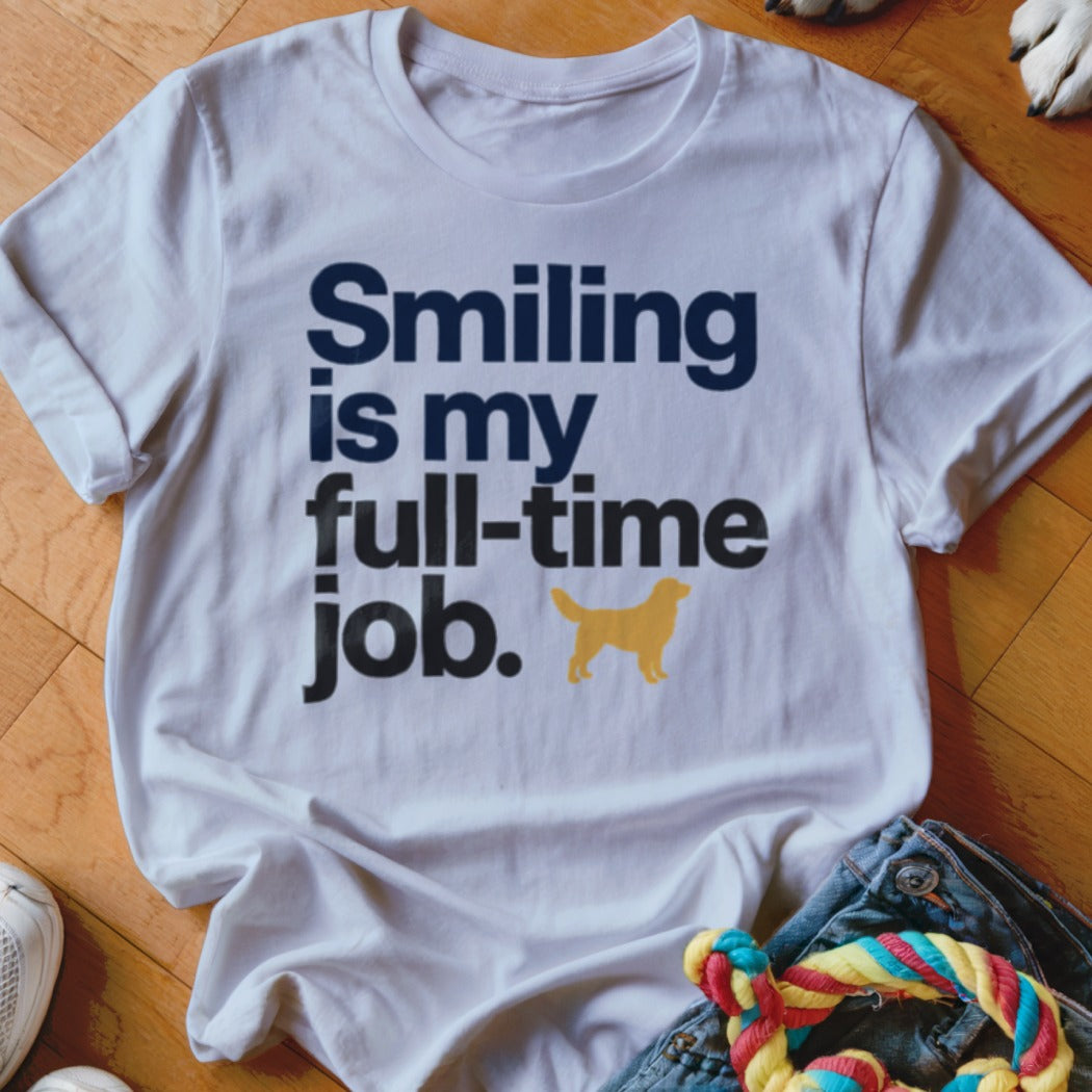 White t-shirt with "Smiling is my full-time job." text and golden retriever silhouette.