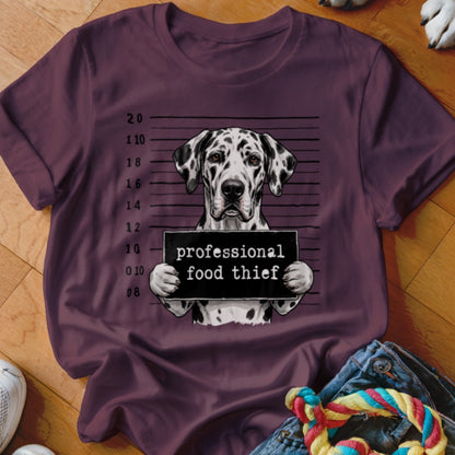Dalmatian dog mugshot with "professional food thief" sign.