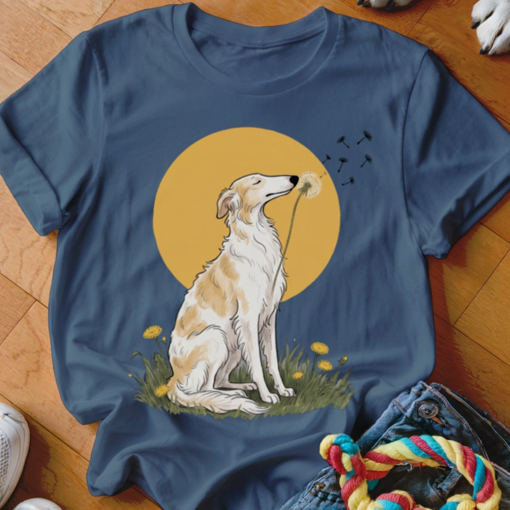 Dark blue t-shirt featuring an illustration of a dog sniffing a dandelion against a yellow sun.