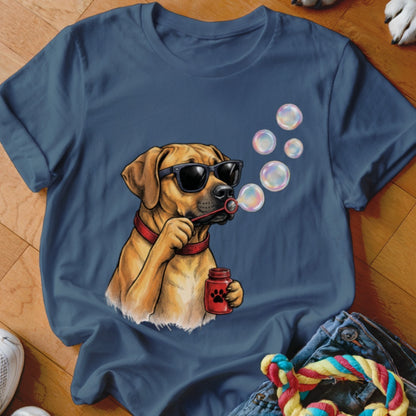 A blue t-shirt printed with a graphic of a dog wearing sunglasses and blowing bubbles.
