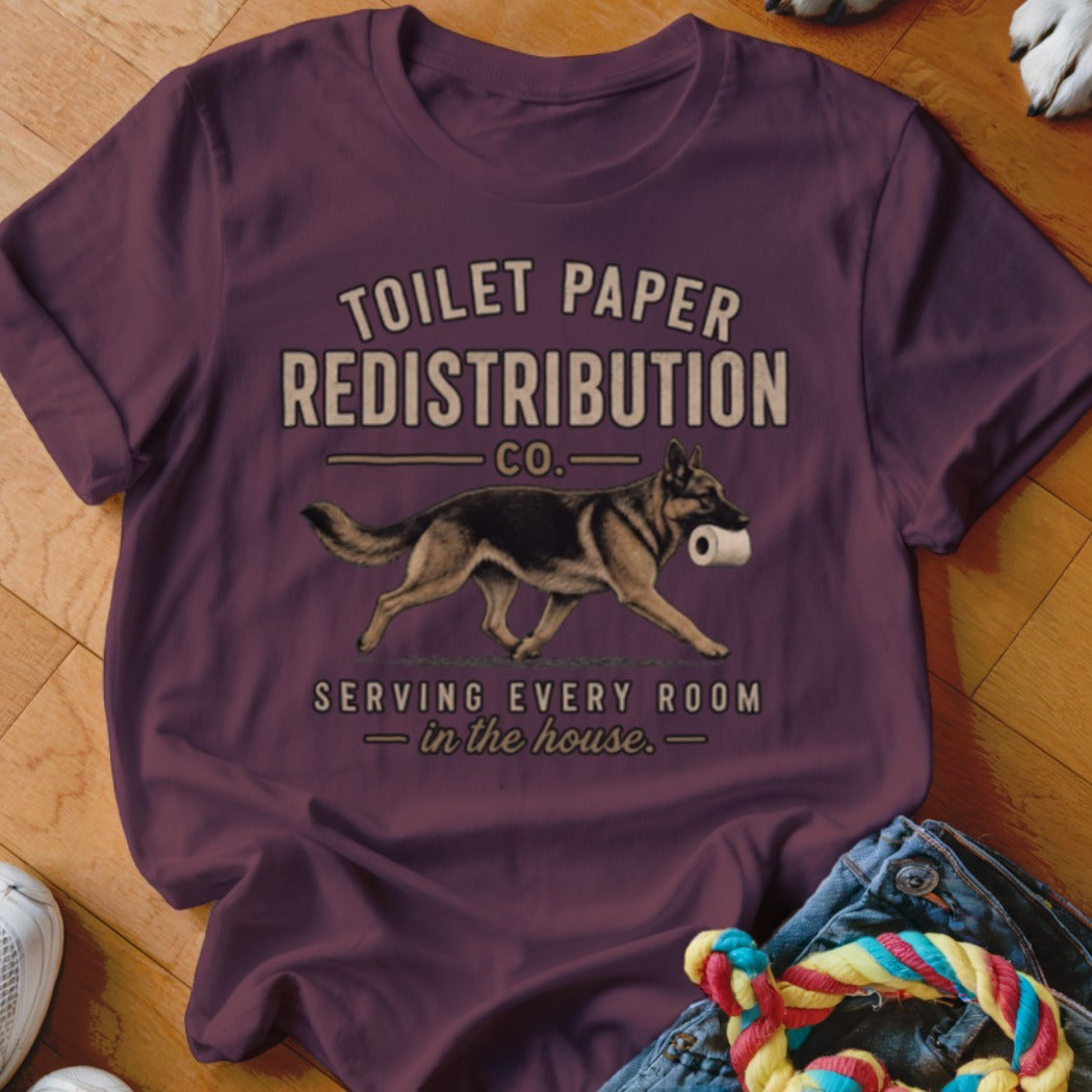 German Shepherd with toilet paper, "TOILET PAPER REDISTRIBUTION CO." text.