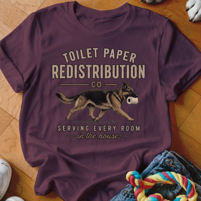 German Shepherd with toilet paper, "TOILET PAPER REDISTRIBUTION CO." text.
