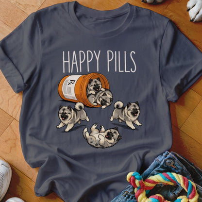 Grey t-shirt with "Happy Pills" text and fluffy puppies spilling from a prescription bottle.