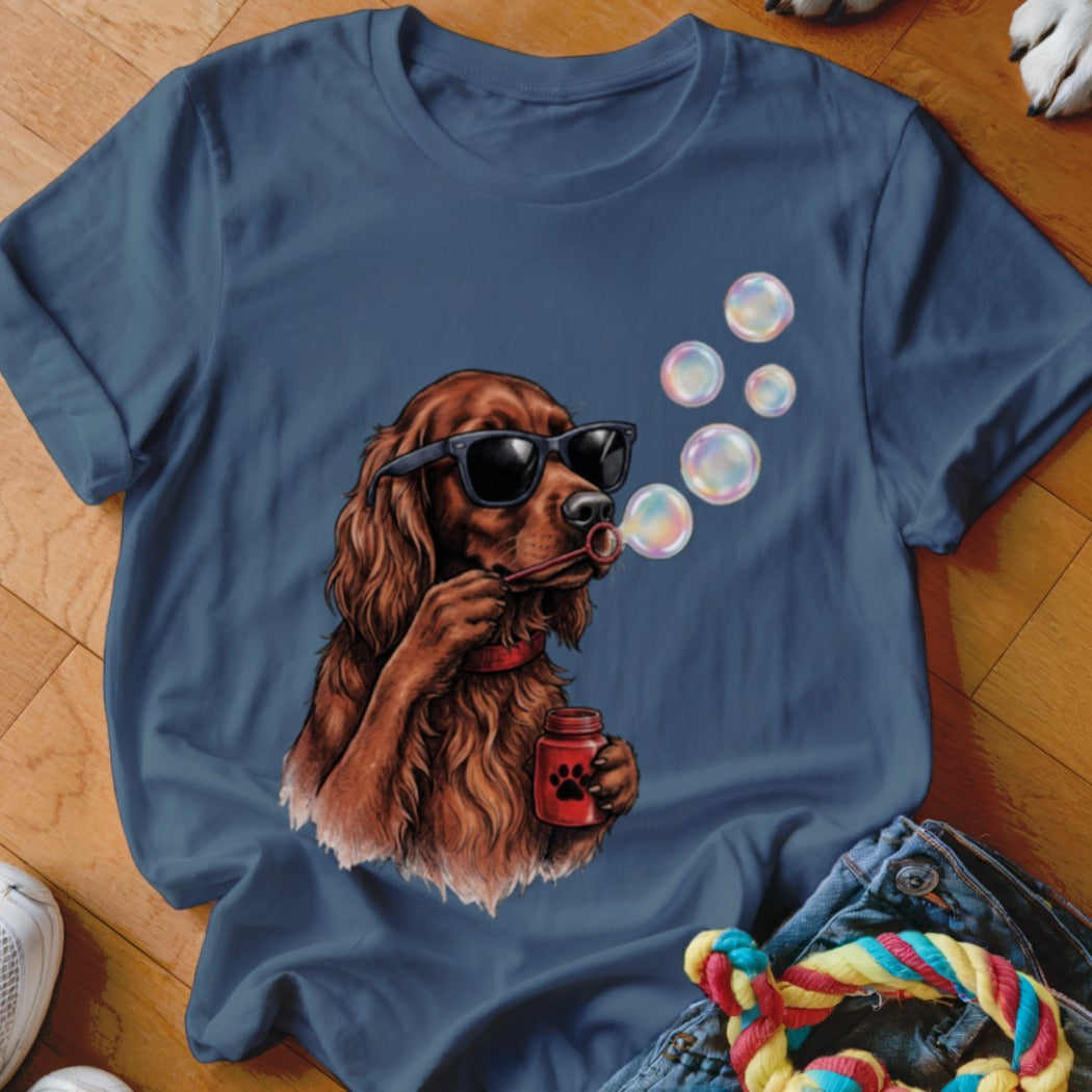 Blue t-shirt featuring a graphic of an Irish Setter wearing sunglasses and blowing soap bubbles.