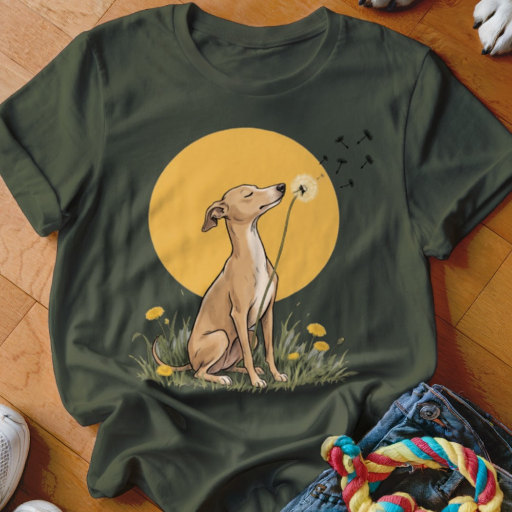 Dark green t-shirt featuring an illustration of a dog blowing dandelion seeds against a yellow sun.
