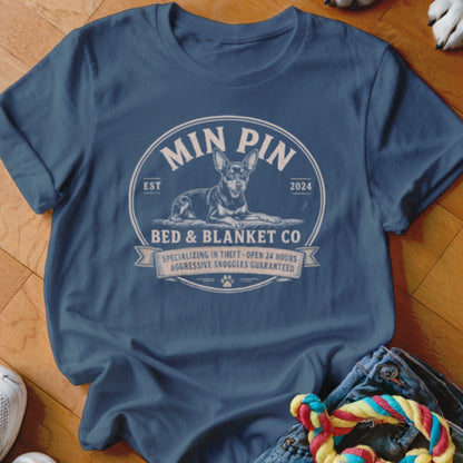 Min Pin Bed & Blanket Co. t-shirt with a dog graphic and humorous text.