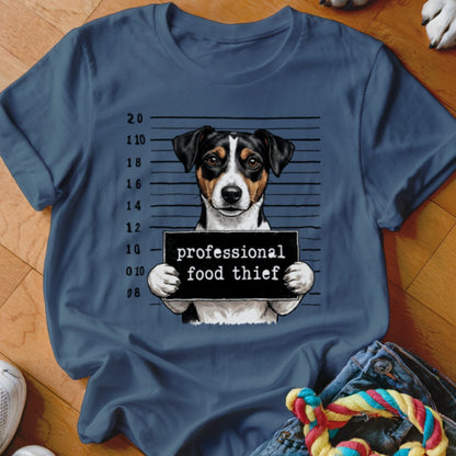 Dog wearing a sign that says "professional food thief" against a mugshot background.