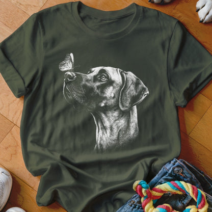 Dark green t-shirt featuring a white sketch of a dog looking at a butterfly on its nose.