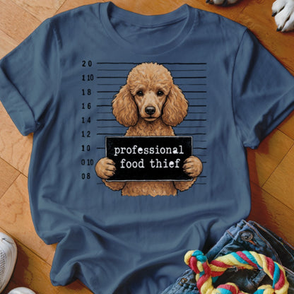 Brown poodle mugshot with "professional food thief" sign.