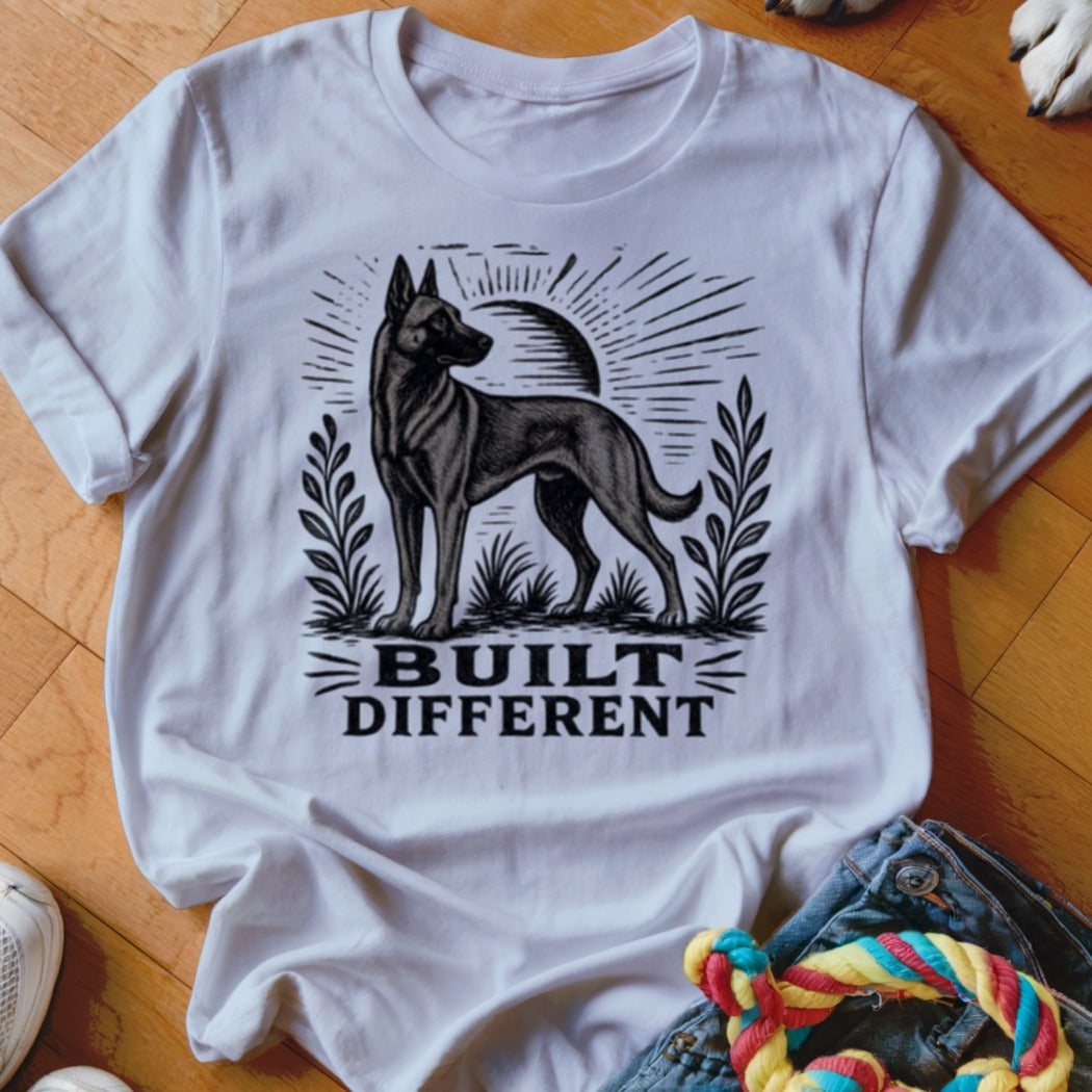 White t-shirt with black graphic of a dog and text "BUILT DIFFERENT".