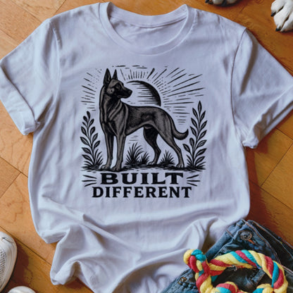 White t-shirt with black graphic of a dog and text "BUILT DIFFERENT".