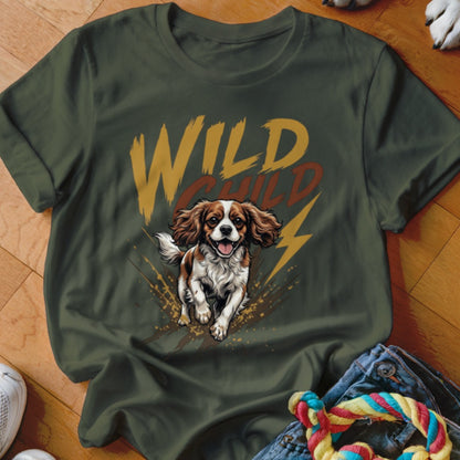 An olive green crewneck t-shirt featuring a graphic of a running Cavalier King Charles Spaniel and the text WILD CHILD.