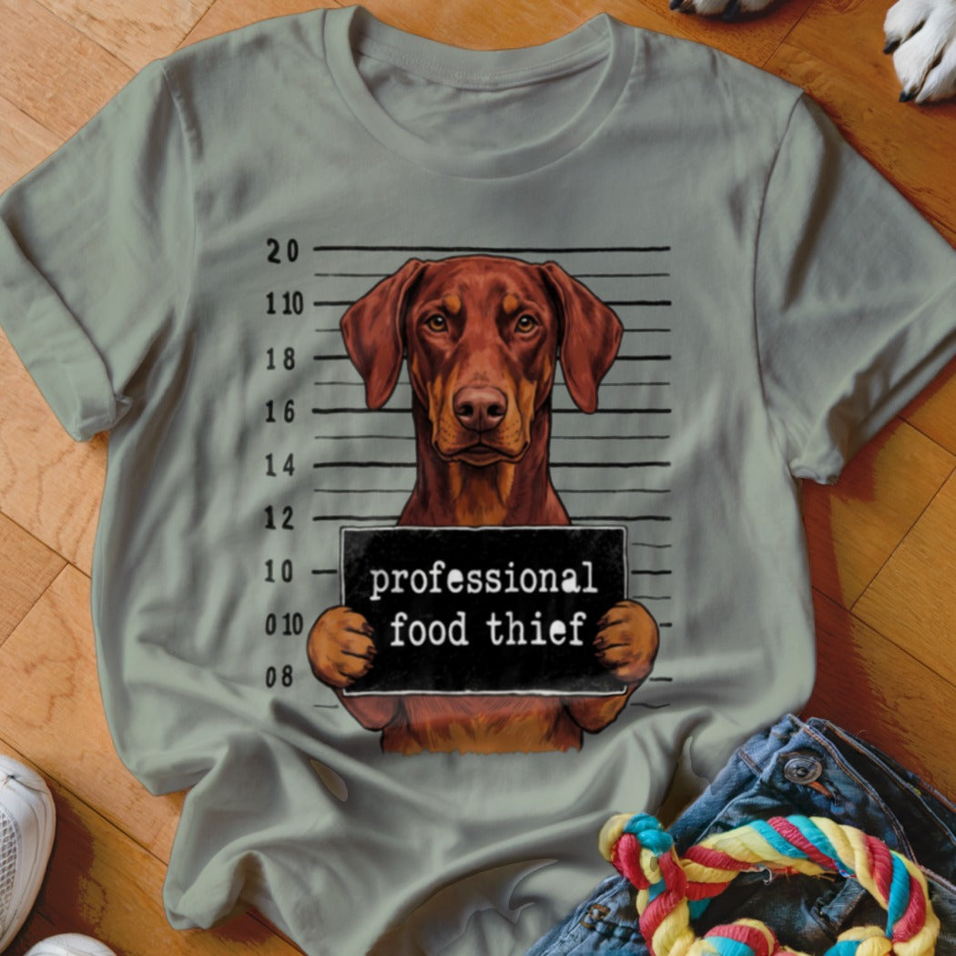 Brown dog mugshot with text "professional food thief".