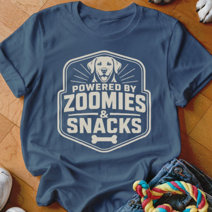 Blue t-shirt with graphic "Powered by Zoomies & Snacks" and a dog.