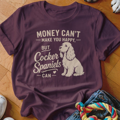Burgundy t-shirt with white text: "Money Can't Make You Happy, But Cocker Spaniels Can."