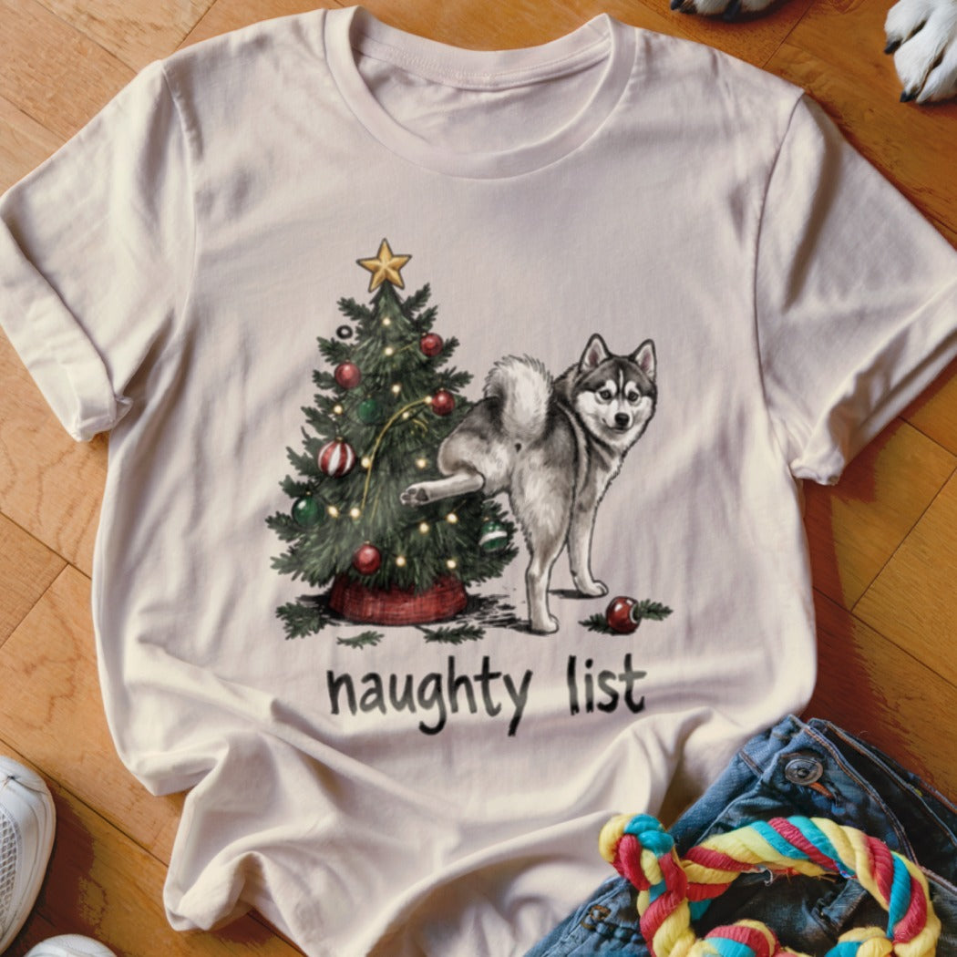 White t-shirt with a husky and Christmas tree graphic, text reads "naughty list".
