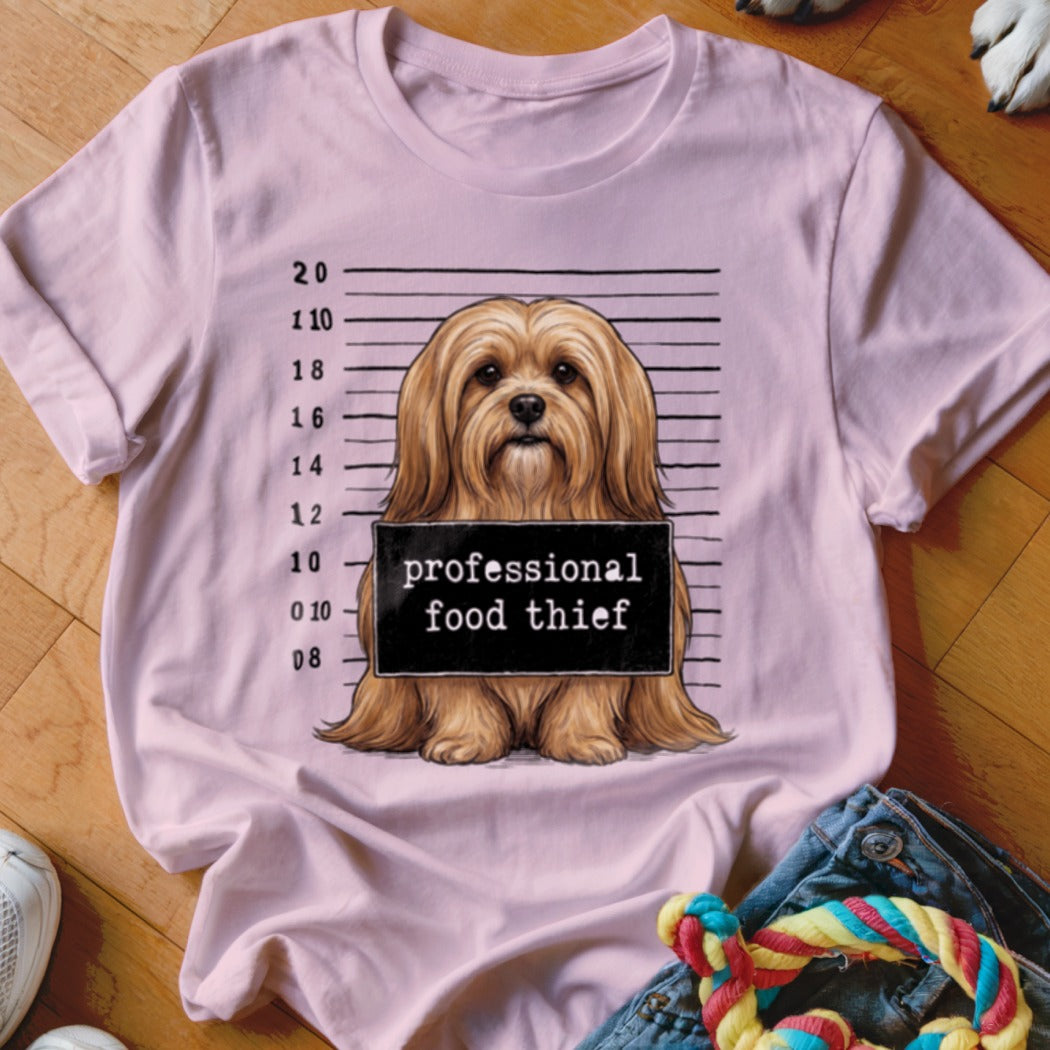 Light pink t-shirt with a dog mugshot graphic: "professional food thief".