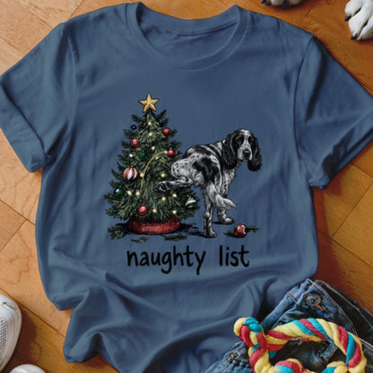 Dog lifting leg on Christmas tree with "naughty list" text.